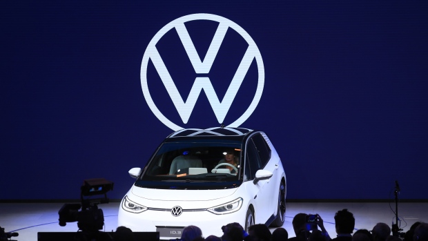 attendees-inspect-a-volkswagen-ag-vw-id-3-electric-automobiles-during-a-preview-event-ahead-of-its-world-premiere-at-the-vw-group-night-ahead-at-the-iaa-frankfurt-motor-show-in-frankfurt-germany-on-monday-sept-9-2019-the-.jpg